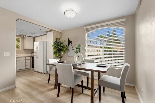 a view of a dining room with furniture and window