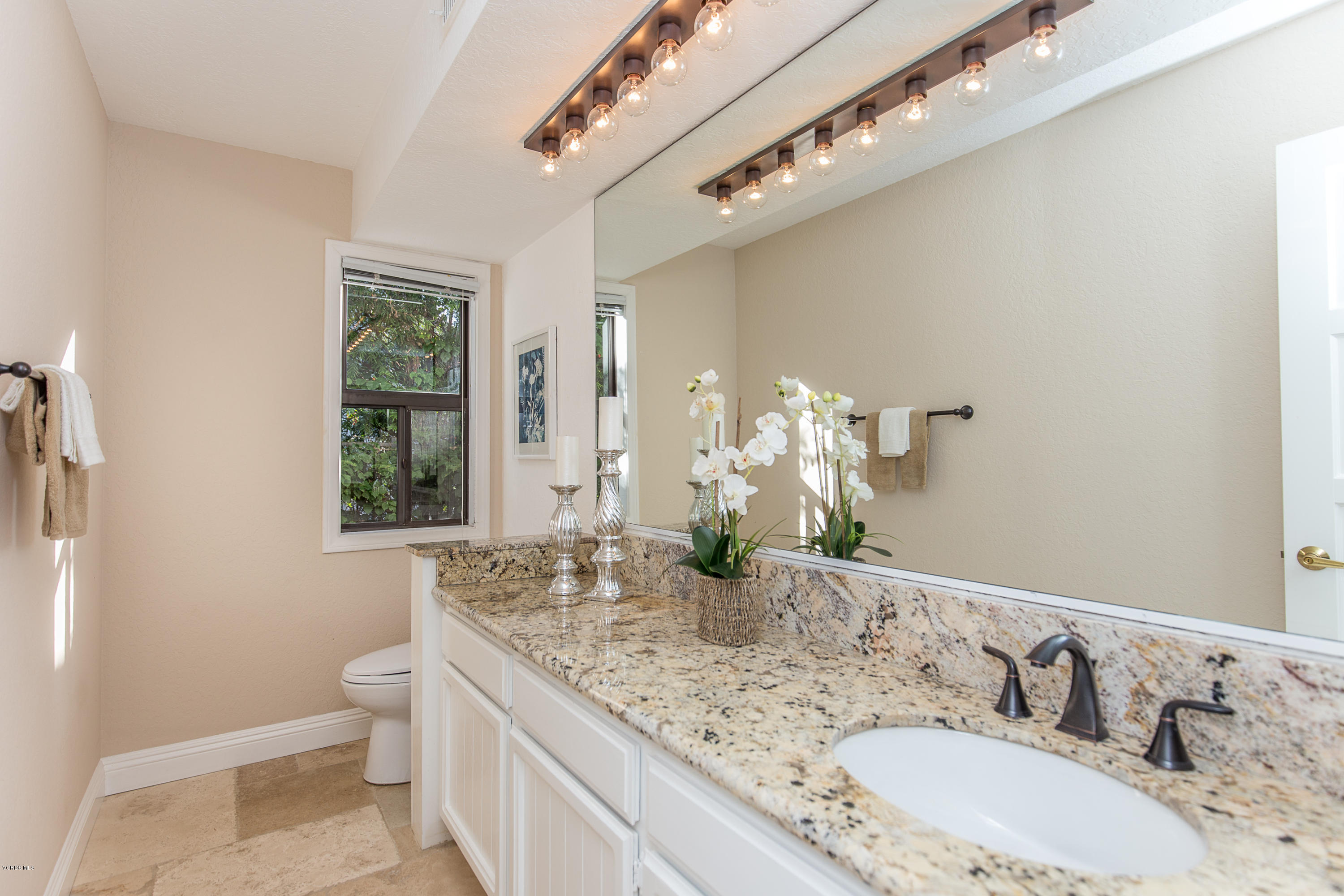 1720 Upper Ranch Road Westlake Village, CA 91362 - Photo 14 of 30 a bathroom with a granite countertop double vanity and a mirror