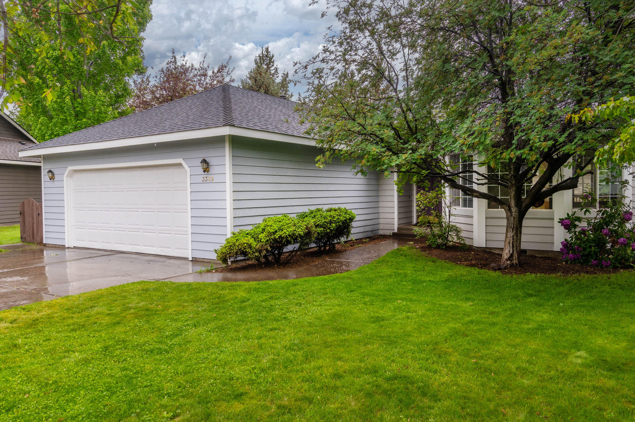 3389 Northeast Stonebrook Loop Bend, OR 97701 - Photo 2 of 27 Large lawn areas on both sides and the rear of home.