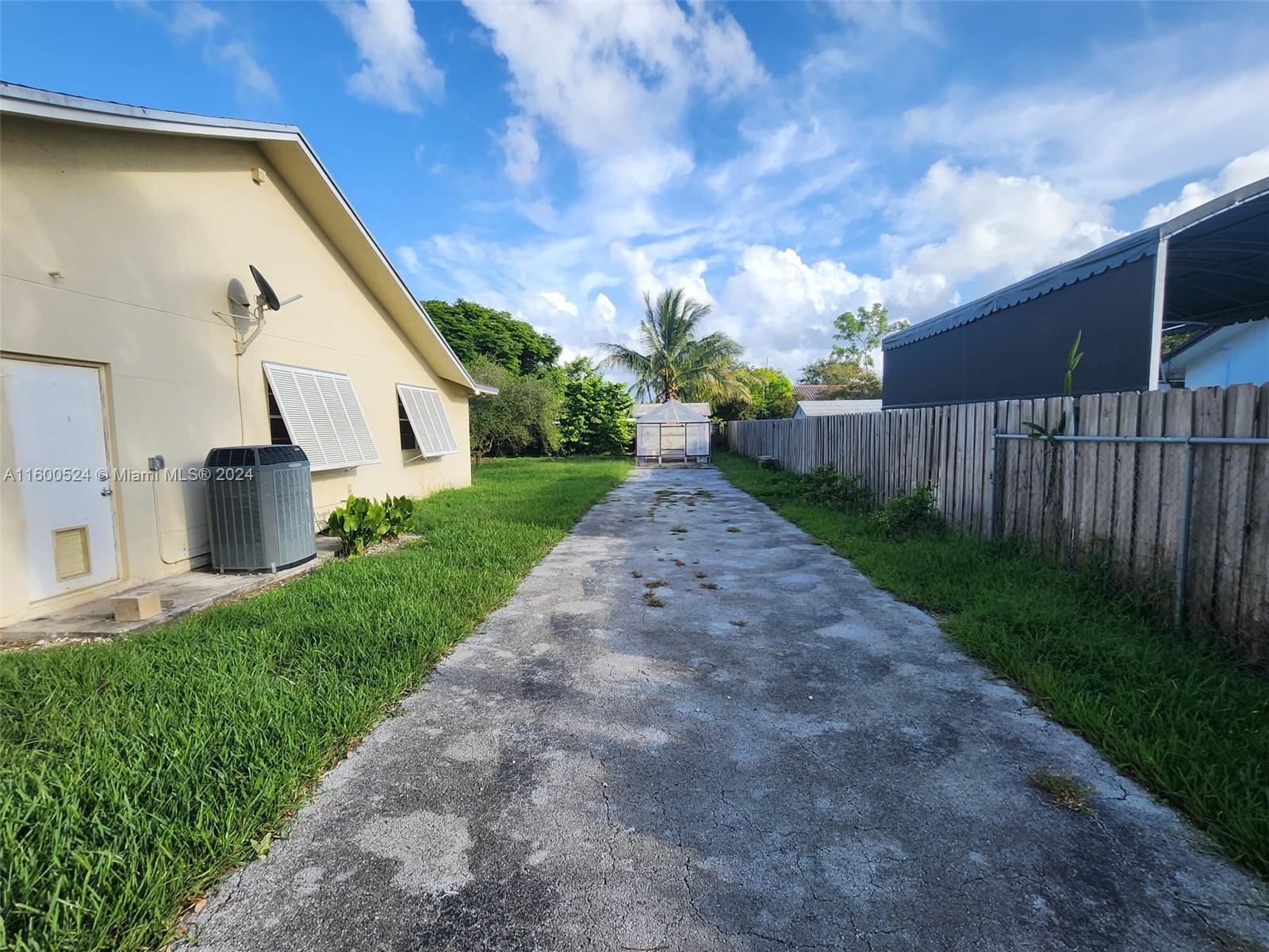 16240 Southwest 286th Street Homestead, FL 33033 - Photo 7 of 14 a view of a back yard of the house