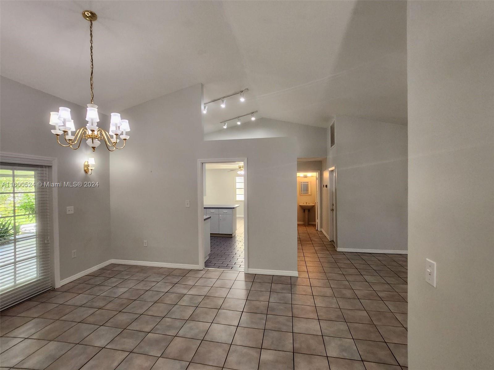 16240 Southwest 286th Street Homestead, FL 33033 - Photo 10 of 14 a view of a chandelier and entryway