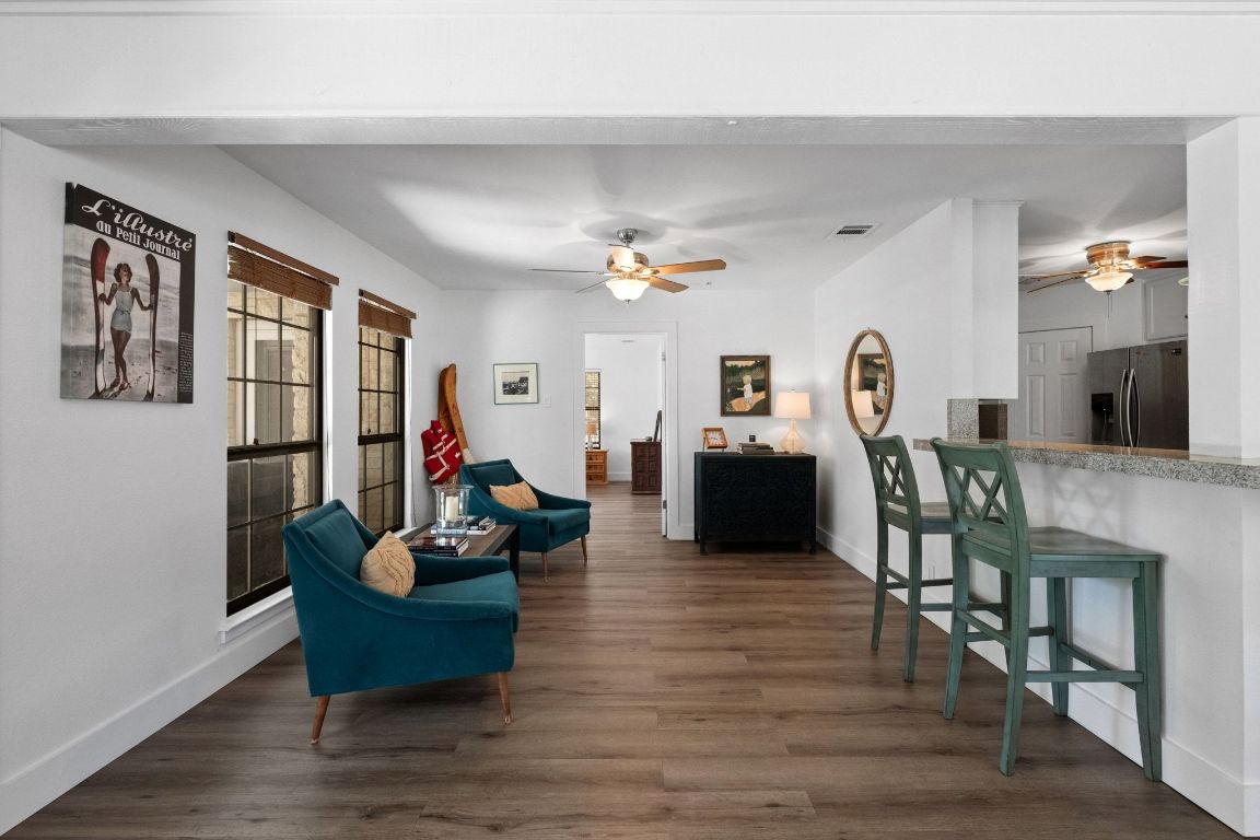 1709 Channel Road Austin, TX 78746 - Photo 12 of 27 a living room with furniture and wooden floor