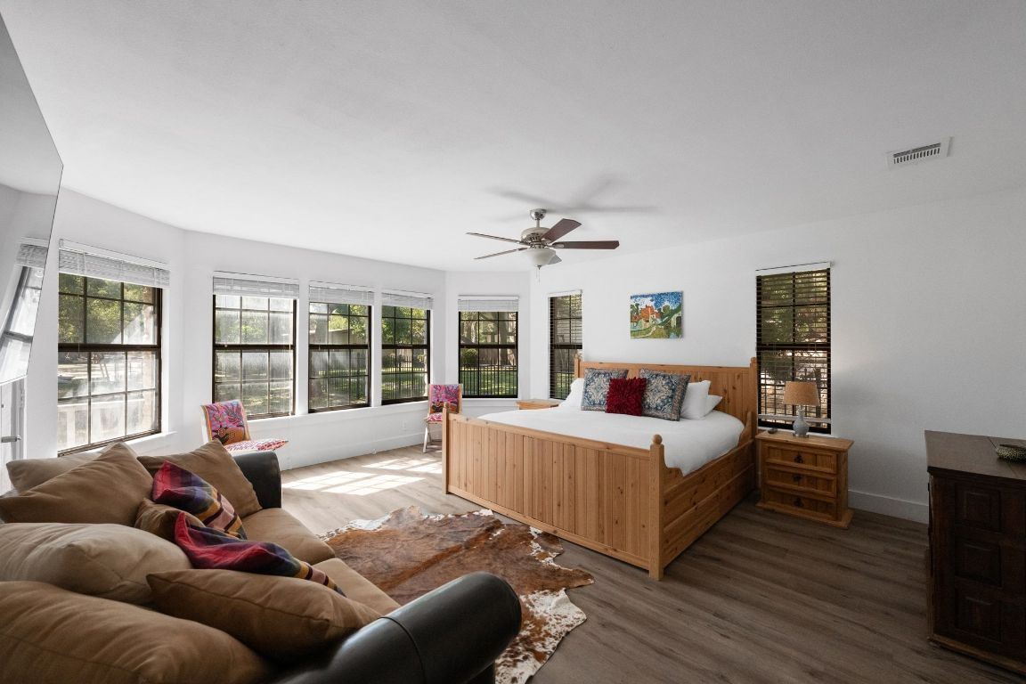 1709 Channel Road Austin, TX 78746 - Photo 14 of 27 a living room with furniture and a large window