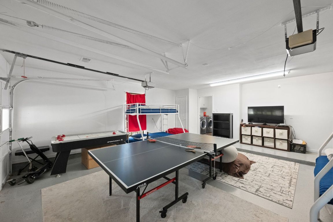 1709 Channel Road Austin, TX 78746 - Photo 25 of 27 a room with furniture and a flat screen tv