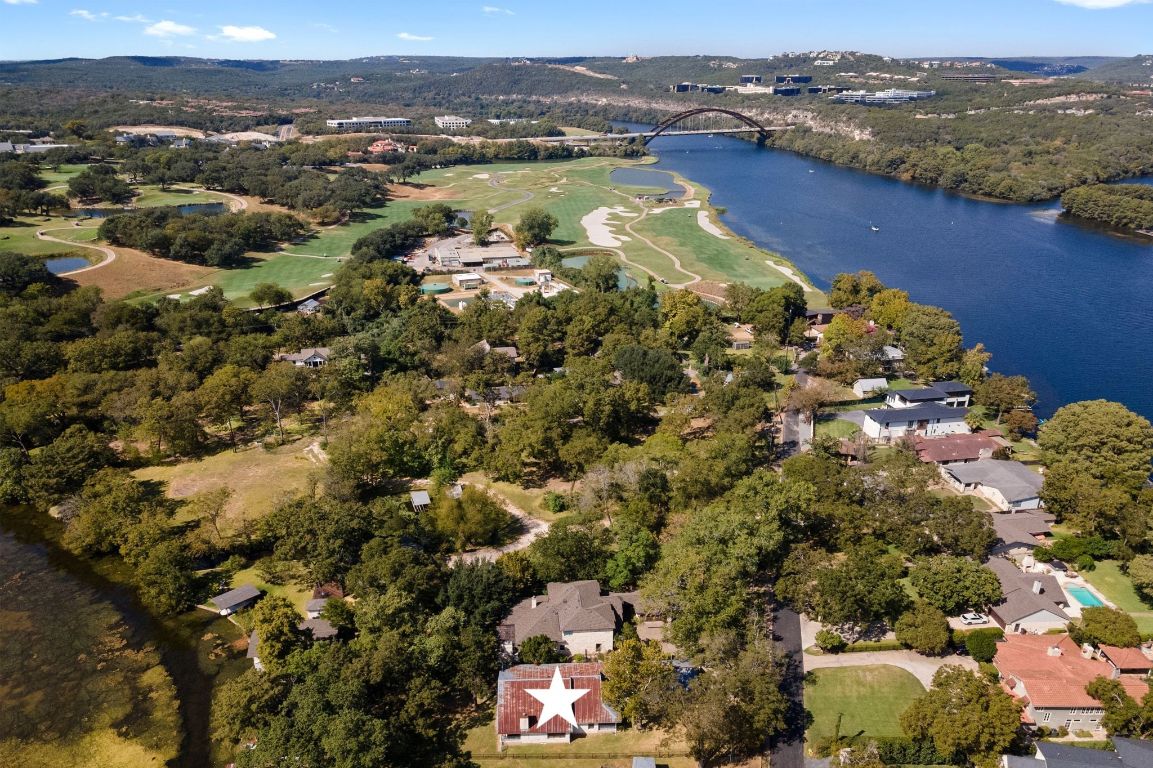 1709 Channel Road Austin, TX 78746 - Photo 27 of 27 an aerial view of residential houses with outdoor space and river