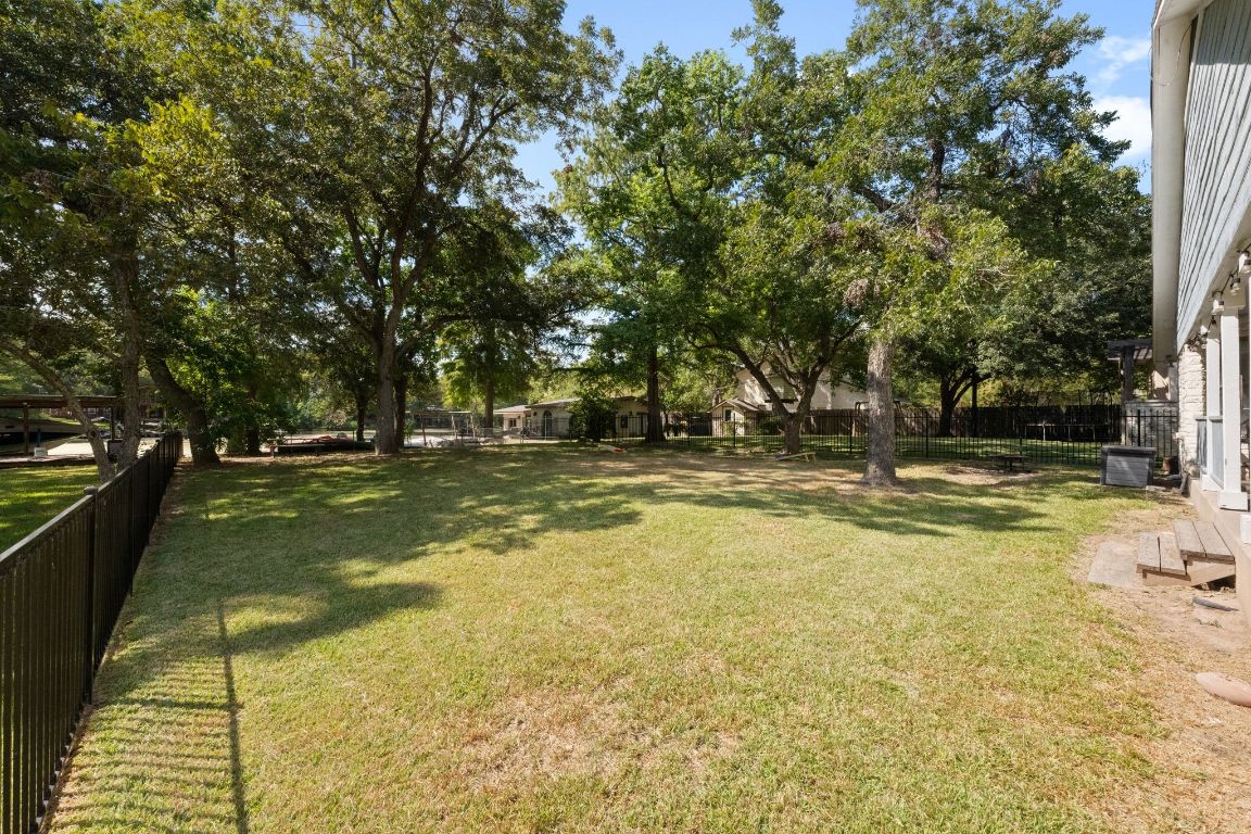 1709 Channel Road Austin, TX 78746 - Photo 4 of 27 a view of swimming pool with yard