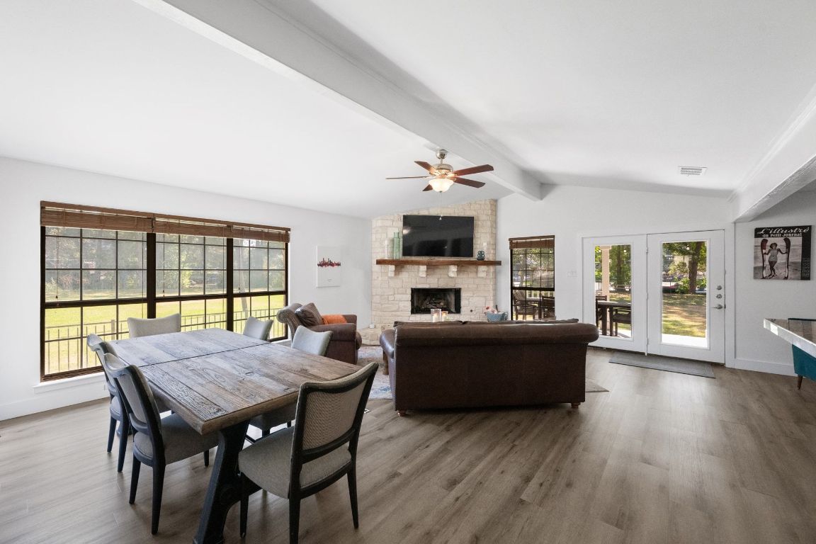 1709 Channel Road Austin, TX 78746 - Photo 6 of 27 a view of a dining room with furniture window and wooden floor