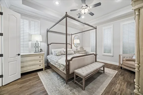 a bedroom with furniture and a window