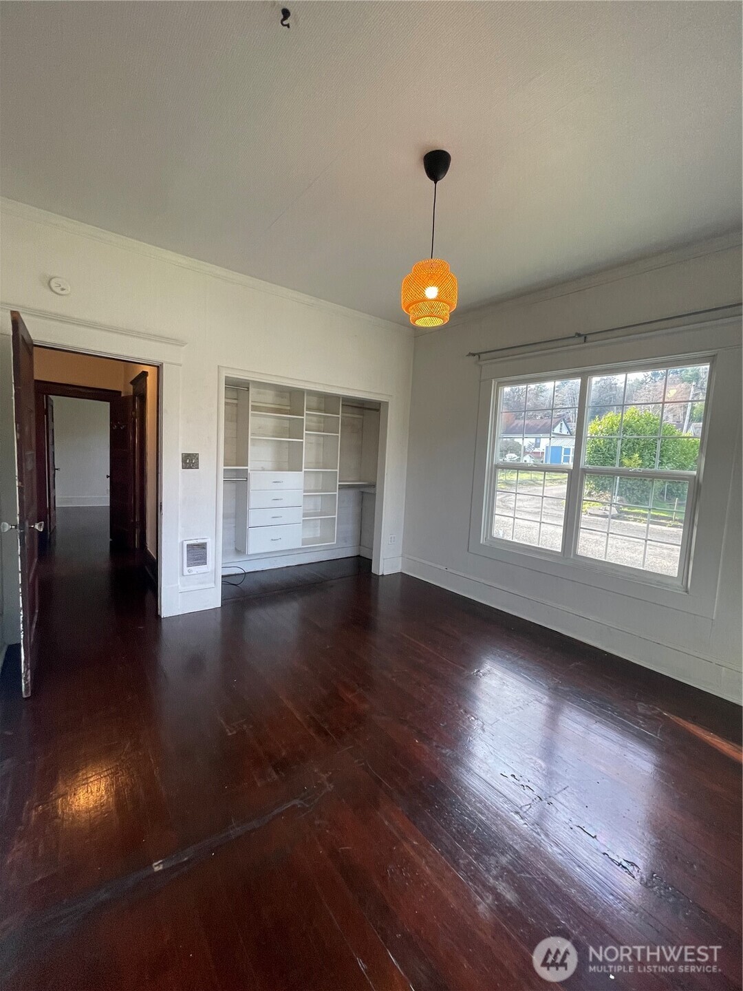 2101 Henkle Street Raymond, WA 98577 - Photo 13 of 18 an empty room with wooden floor and windows