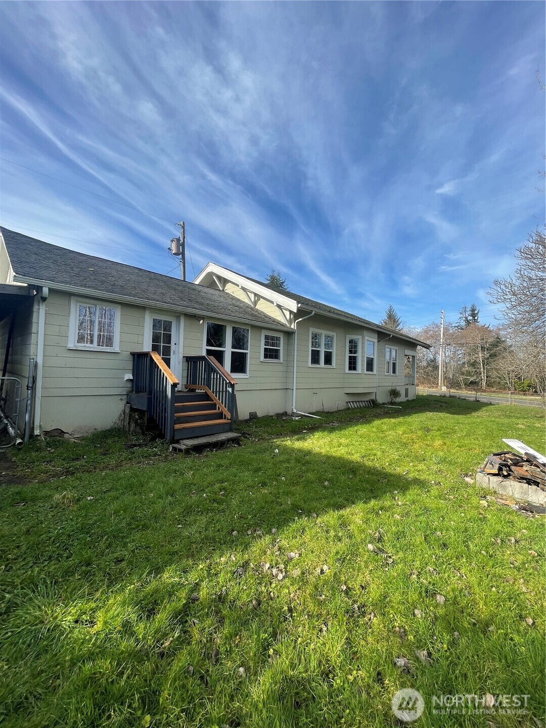 2101 Henkle Street Raymond, WA 98577 - Photo 3 of 18 a view of a house with a backyard