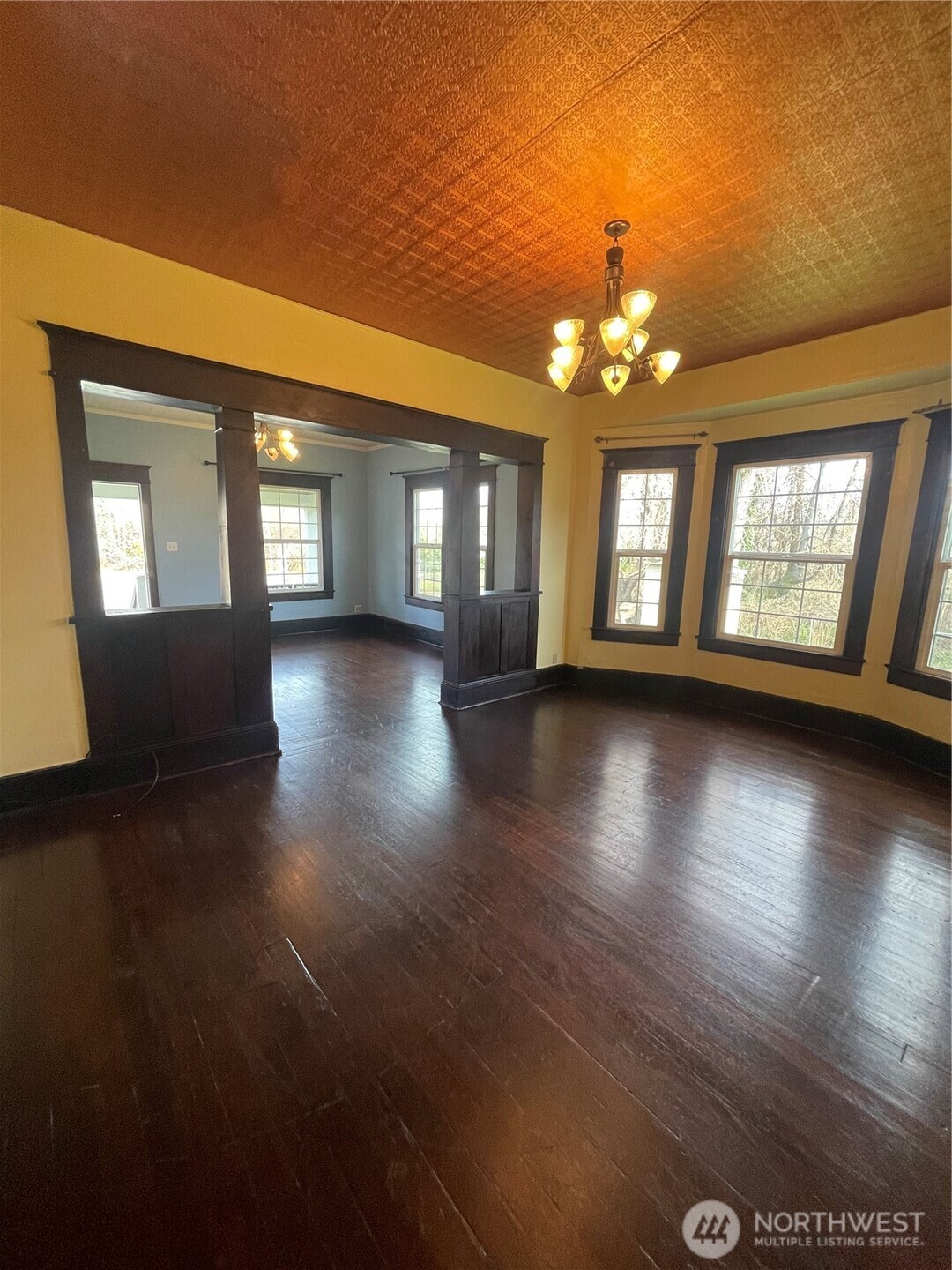 2101 Henkle Street Raymond, WA 98577 - Photo 6 of 18 a view of an empty room with window and wooden floor