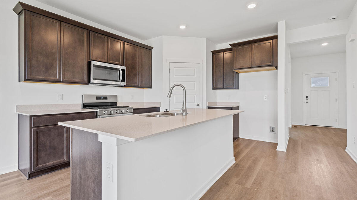 444 Fry Street Hebron, IN 46341 - Photo 2 of 25 a kitchen with stainless steel appliances a sink stove and refrigerator