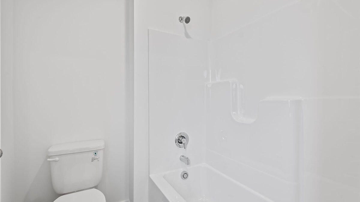 444 Fry Street Hebron, IN 46341 - Photo 23 of 25 a bathroom with a toilet and bathtub