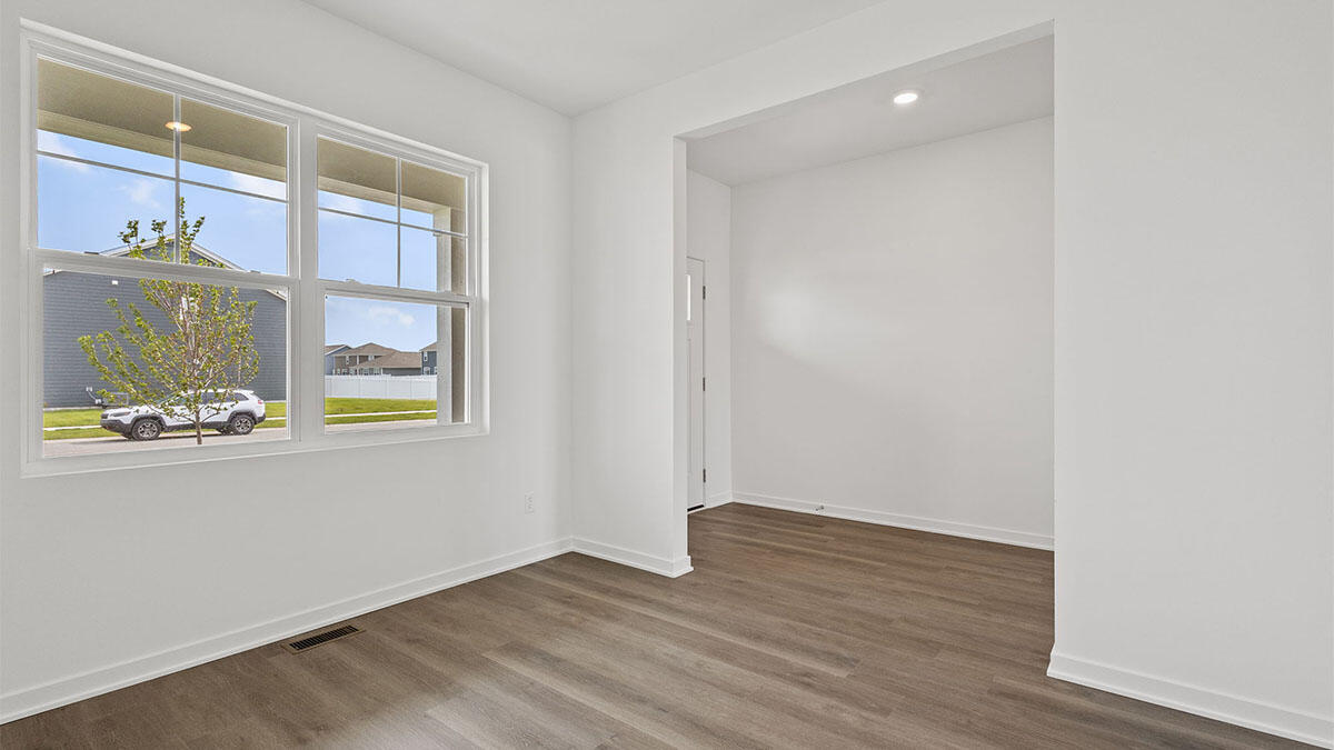 444 Fry Street Hebron, IN 46341 - Photo 6 of 25 an empty room with wooden floor and windows