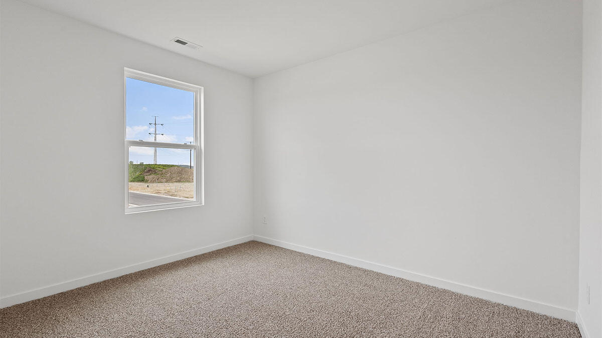 444 Fry Street Hebron, IN 46341 - Photo 7 of 25 a view of an empty room with window and closet area