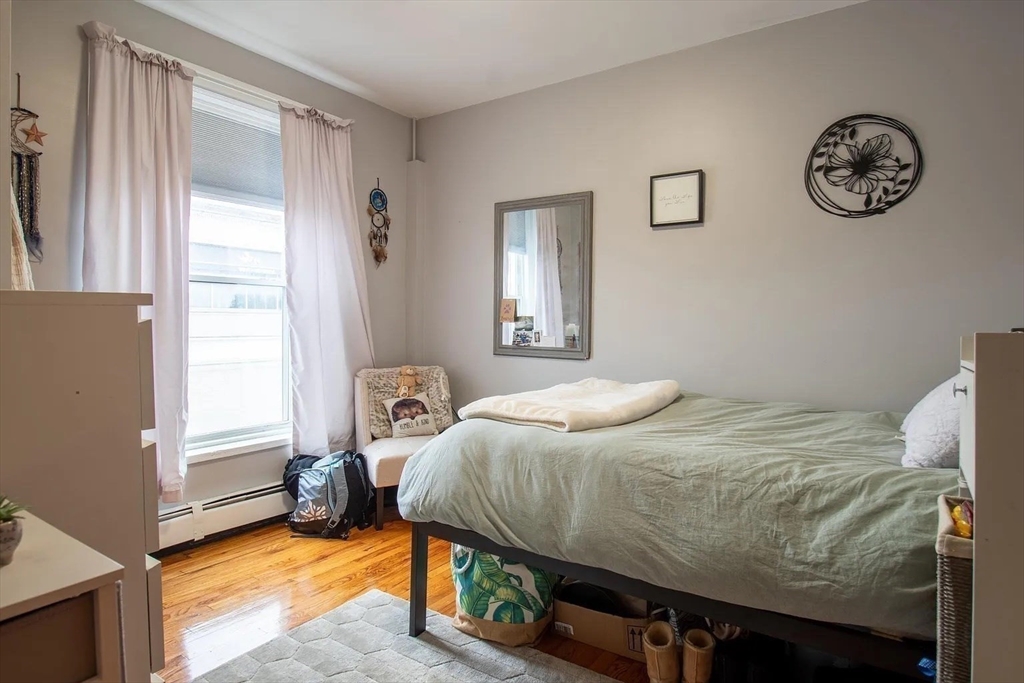 117 Elm Street, Unit 2 Newton, MA 02465 - Photo 6 of 10 a bedroom with a bed and a window