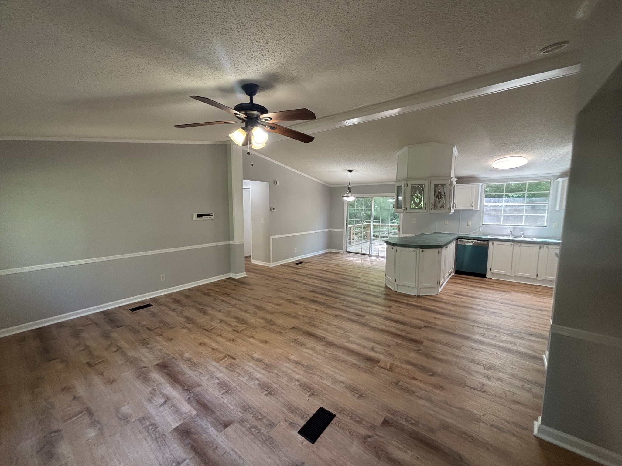 3329 Tackets Branch Road Prospect, TN 38477 - Photo 14 of 24 a view of kitchen and empty room with wooden floor