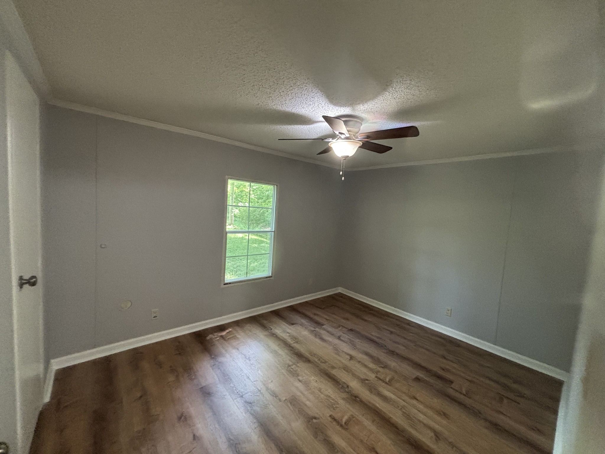 3329 Tackets Branch Road Prospect, TN 38477 - Photo 20 of 24 wooden floor in an empty room with a window