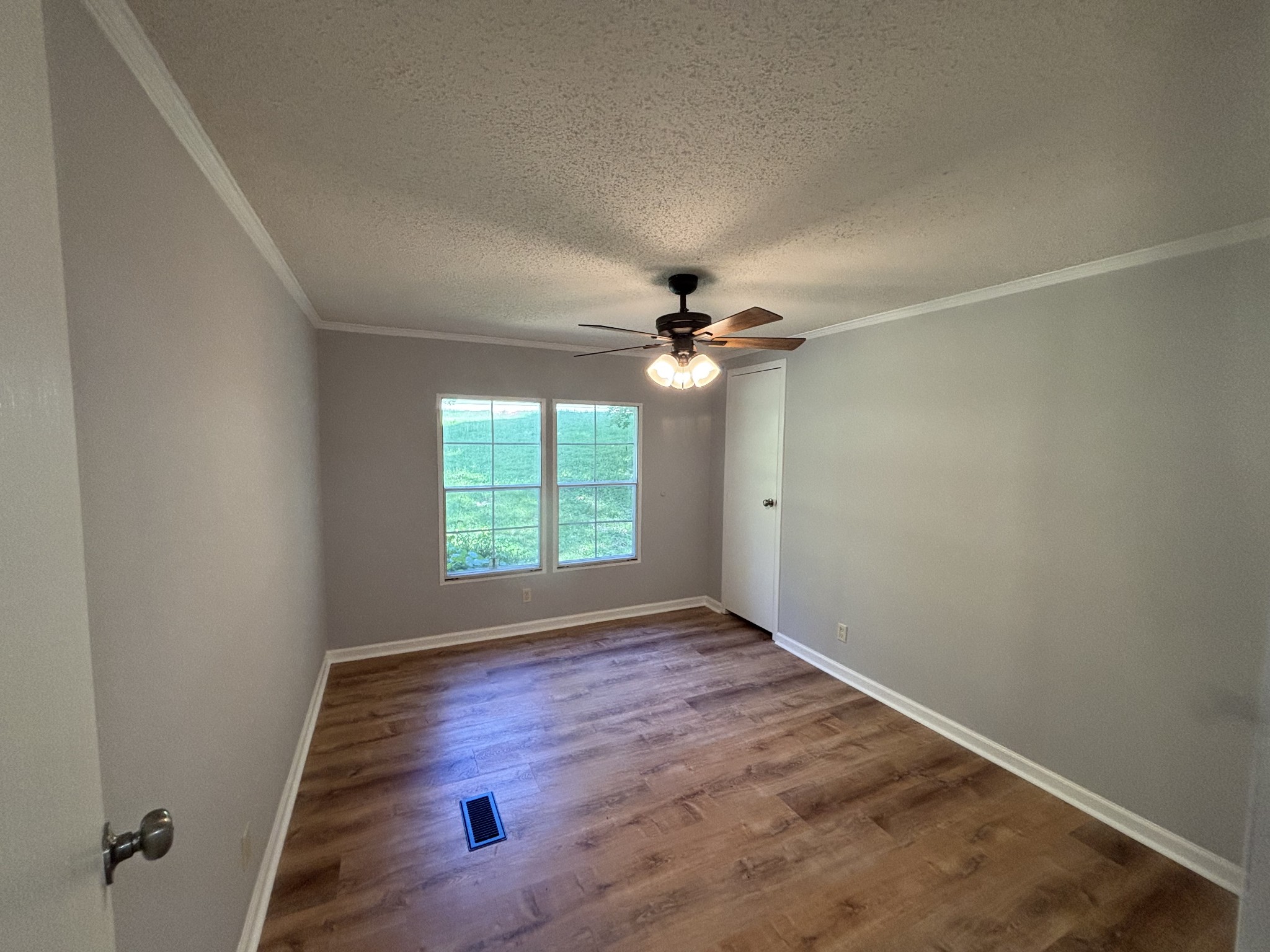 3329 Tackets Branch Road Prospect, TN 38477 - Photo 21 of 24 an empty room with windows and fan