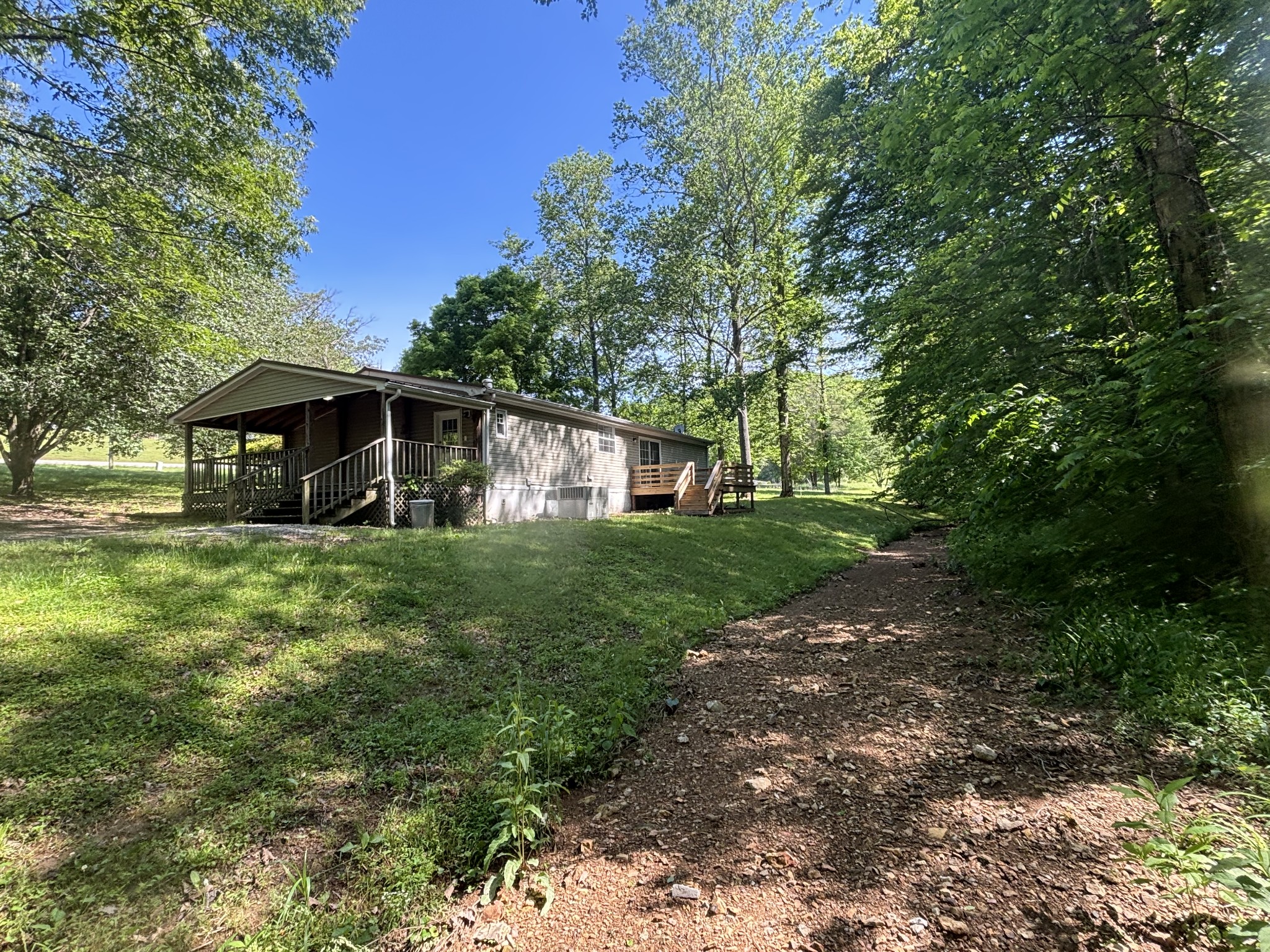 3329 Tackets Branch Road Prospect, TN 38477 - Photo 7 of 24 a front view of a house with a yard