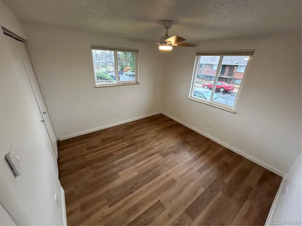 a view of room with window and ceiling fan