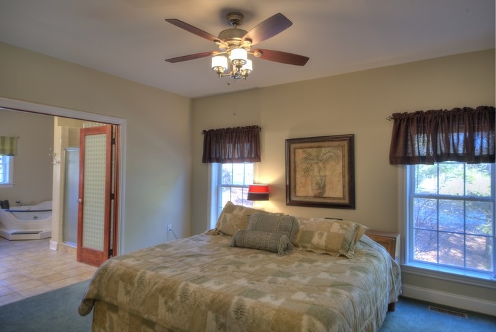 53 Old White Bridge Road Waynesboro, VA 22980 - Photo 22 of 49 a bedroom with a large bed and a window