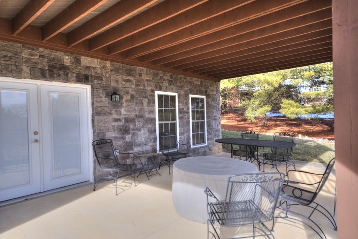 53 Old White Bridge Road Waynesboro, VA 22980 - Photo 46 of 49 a patio with table and chairs and potted plants