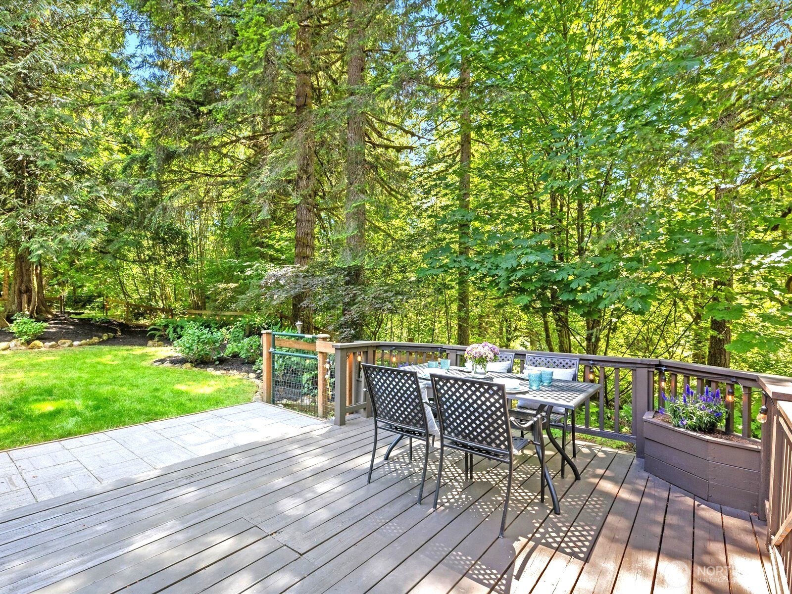 33606 Northeast Lake Joy Road Carnation, WA 98014 - Photo 34 of 40 a view of a chairs and table on the wooden deck