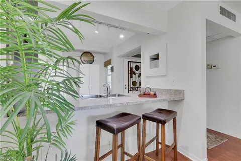 a kitchen with a table and chairs