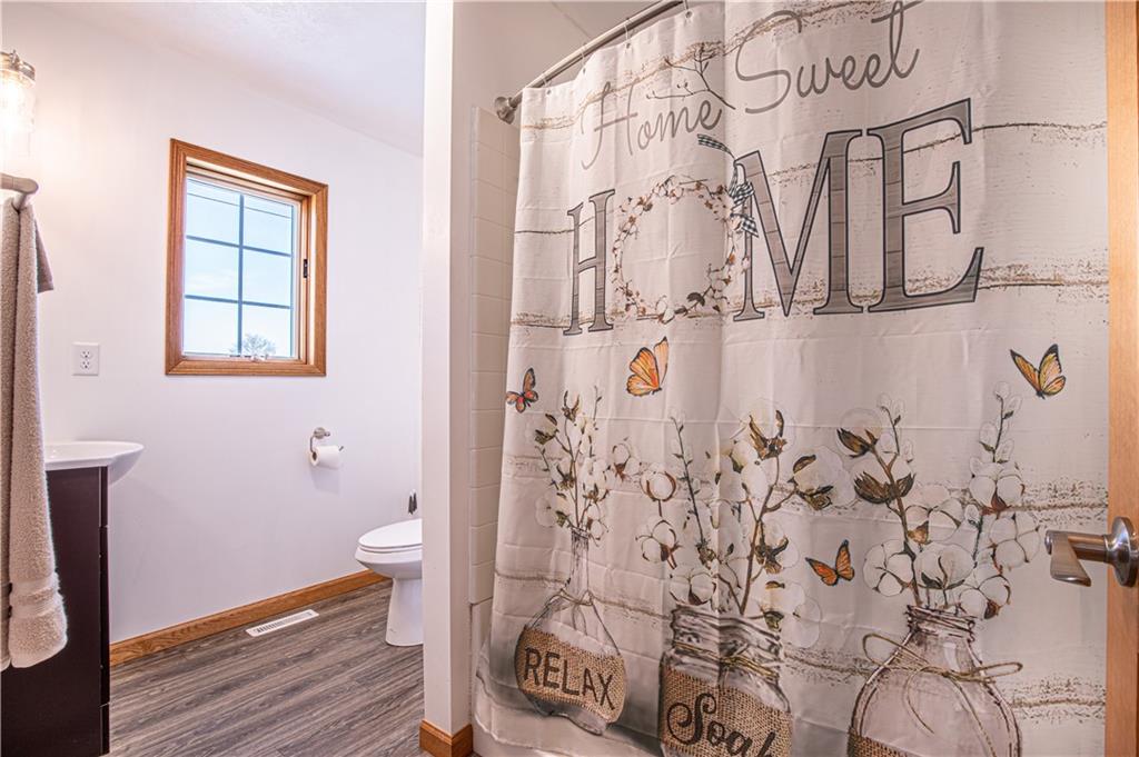 529 Braddock Road Markleysburg, PA 15459 - Photo 4 of 17 a bathroom with a shower curtain