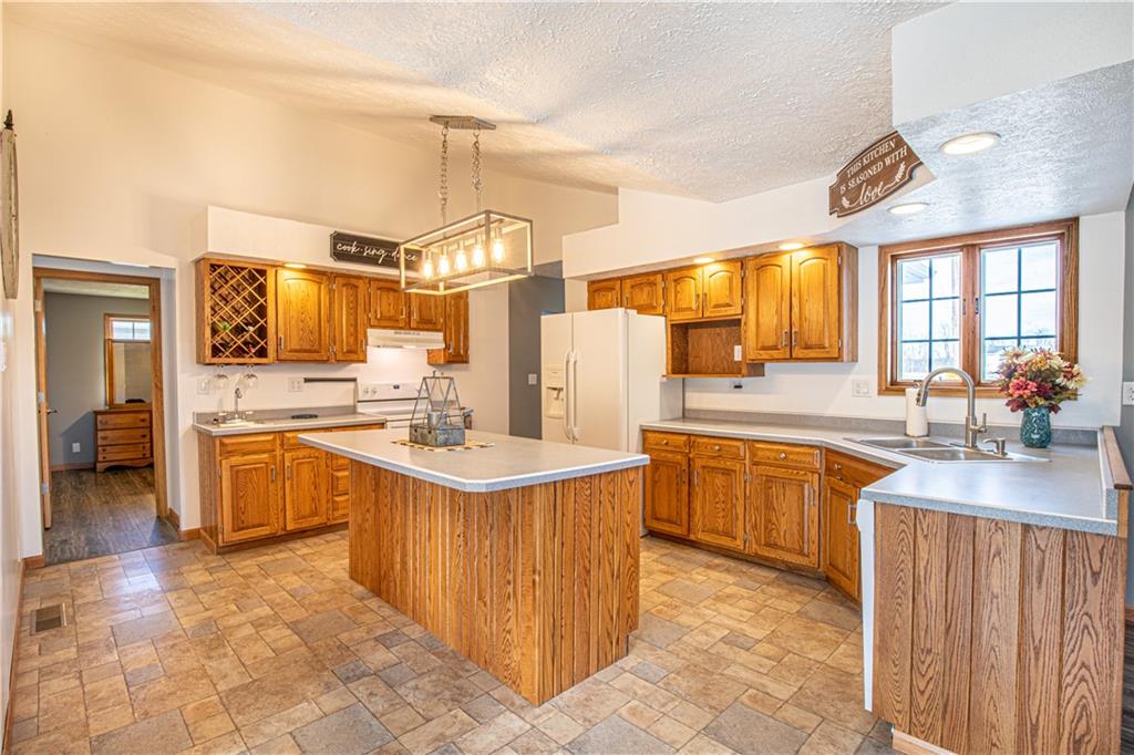 529 Braddock Road Markleysburg, PA 15459 - Photo 7 of 17 a kitchen with a sink stove and cabinets