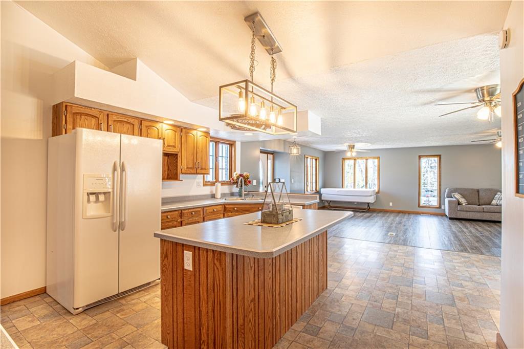 529 Braddock Road Markleysburg, PA 15459 - Photo 8 of 17 a kitchen with stainless steel appliances granite countertop a refrigerator a sink and a stove