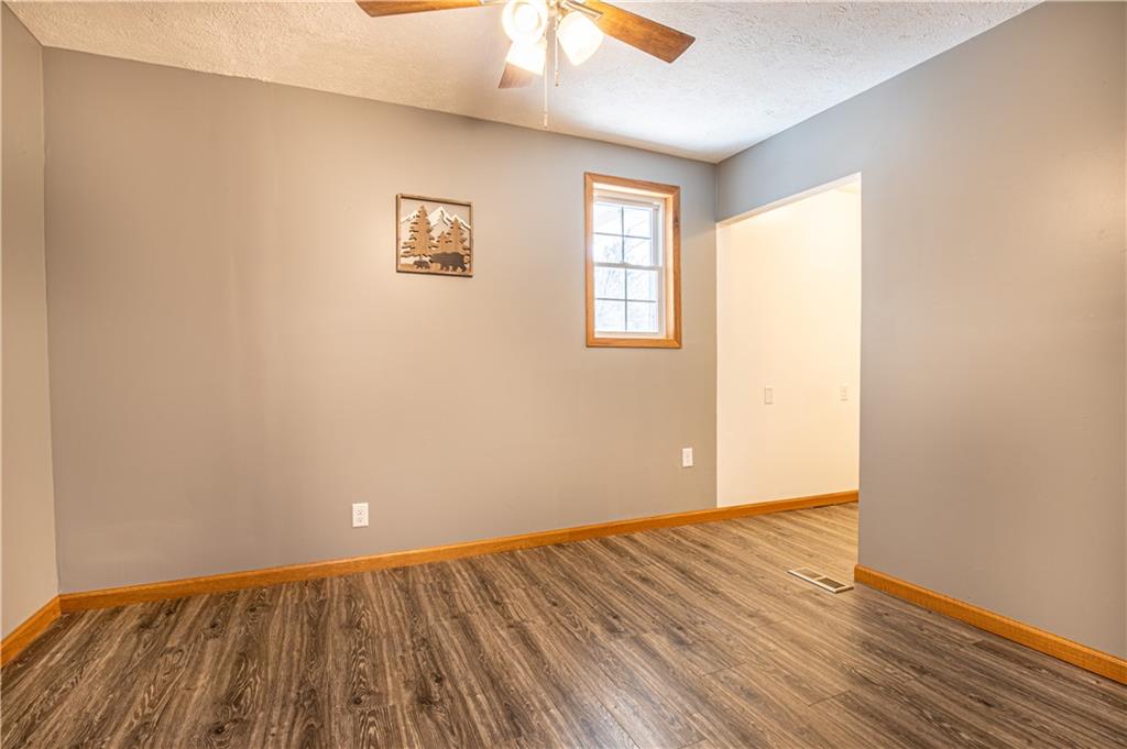 529 Braddock Road Markleysburg, PA 15459 - Photo 10 of 17 an empty room with wooden floor and windows