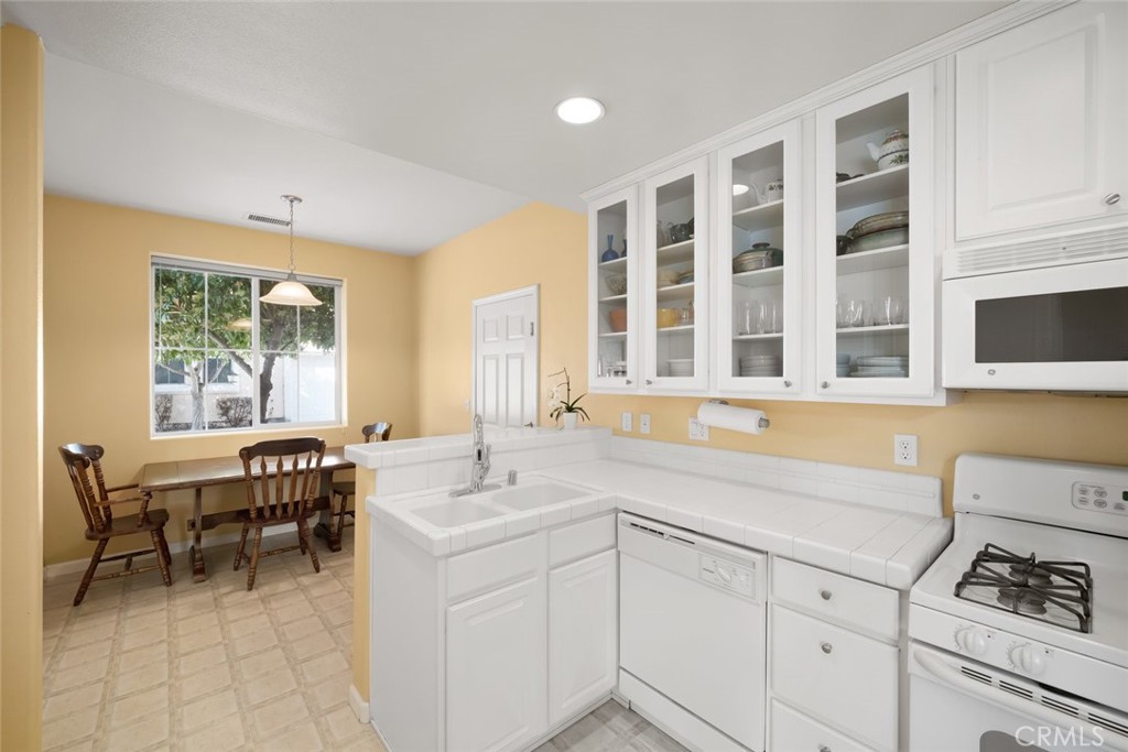 733 Cottage Lane Paso Robles, CA 93446 - Photo 14 of 47 a kitchen with a sink and chairs