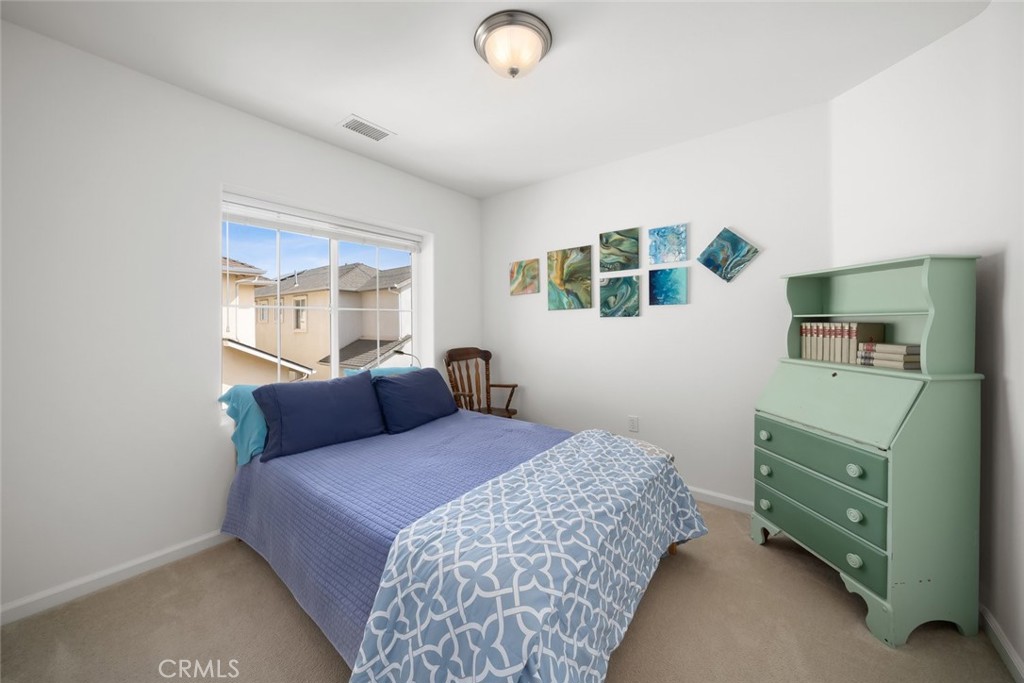 733 Cottage Lane Paso Robles, CA 93446 - Photo 21 of 47 a bedroom with a bed and a painting on the wall