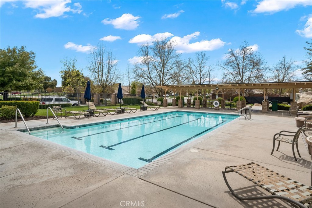 733 Cottage Lane Paso Robles, CA 93446 - Photo 44 of 47 a view of swimming pool with outdoor seating and a buildings in the background
