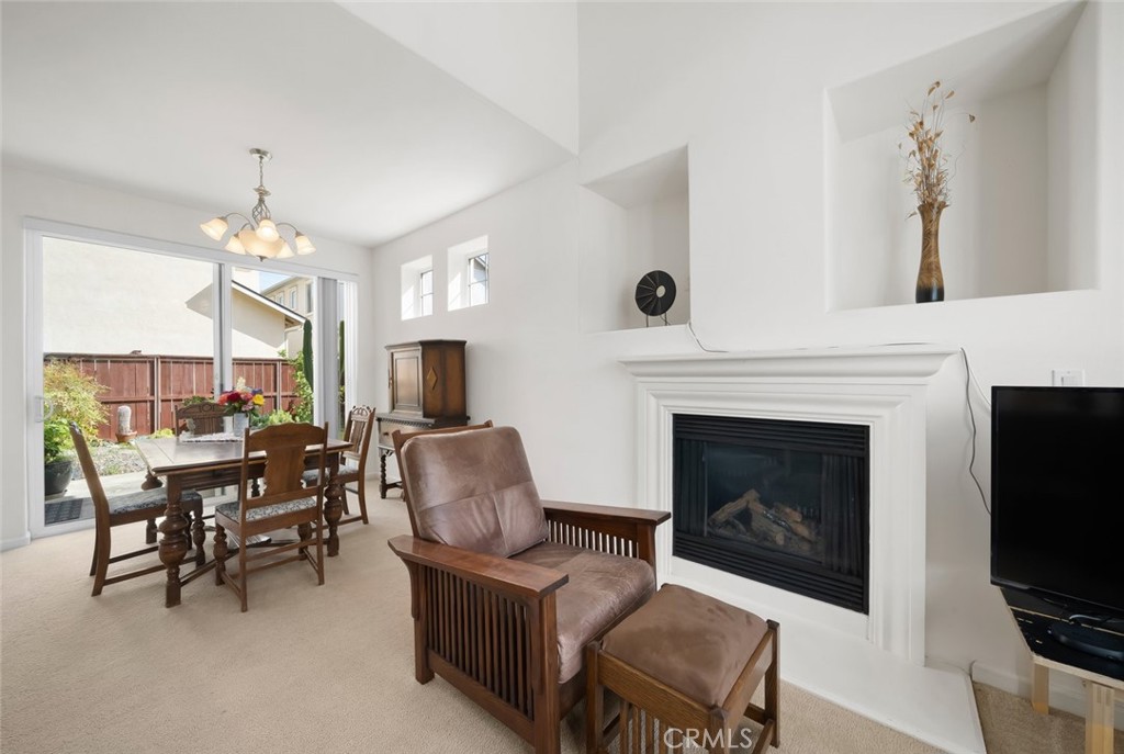 733 Cottage Lane Paso Robles, CA 93446 - Photo 7 of 47 a living room with furniture a fireplace and a flat screen tv