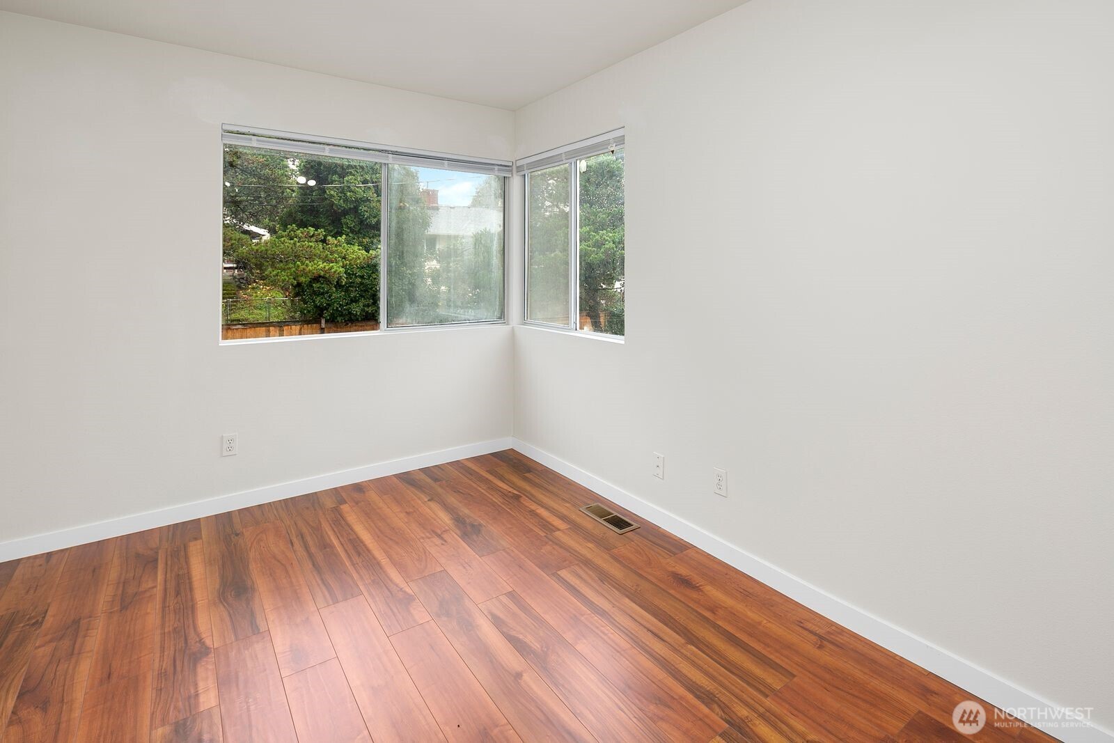 2367 South Forest Street Seattle, WA 98144 - Photo 9 of 33 an empty room with wooden floor and windows