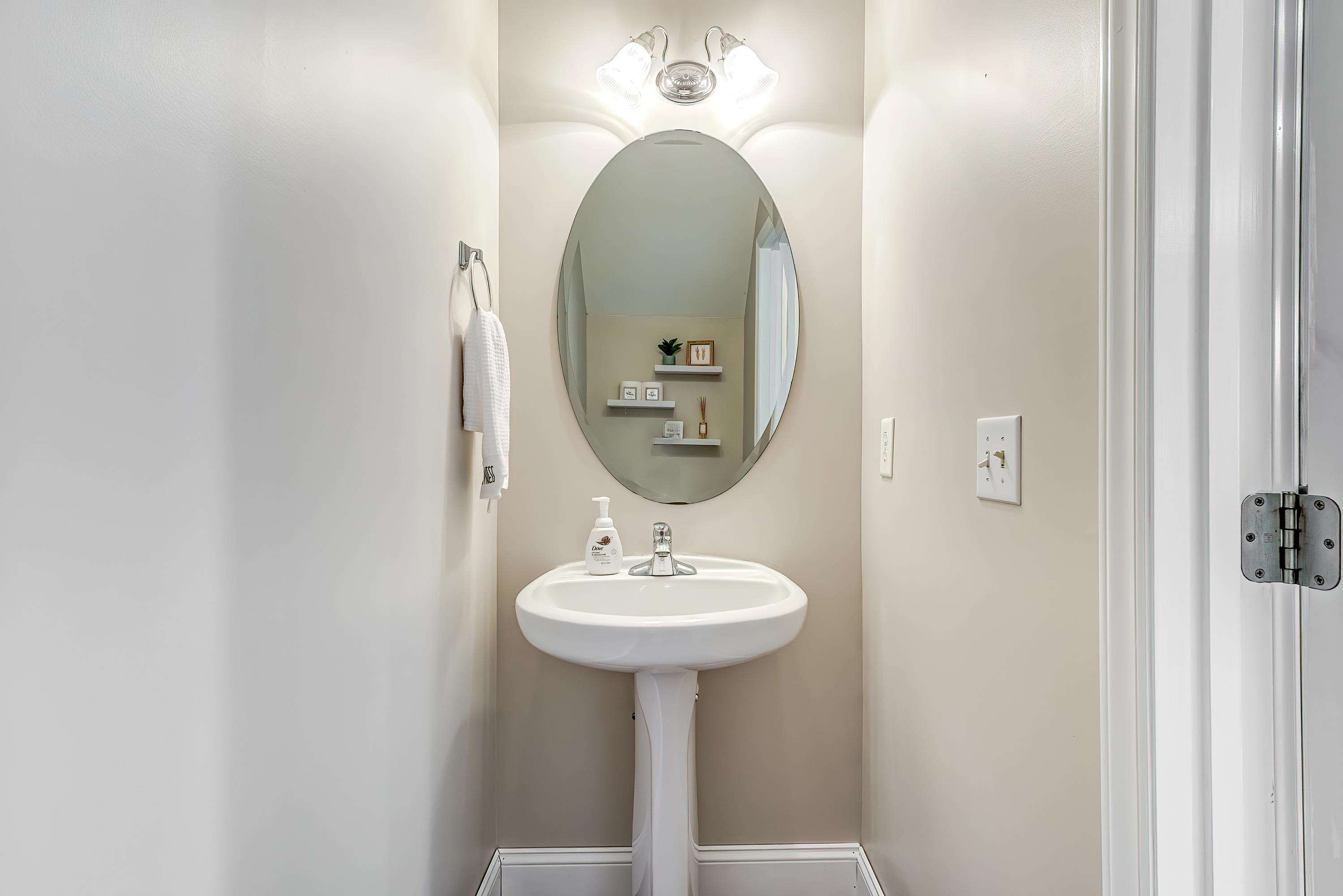 2131 Piney Brook Road, Unit 104 Raleigh, NC 27614 - Photo 20 of 37 a bathroom with a sink and a mirror