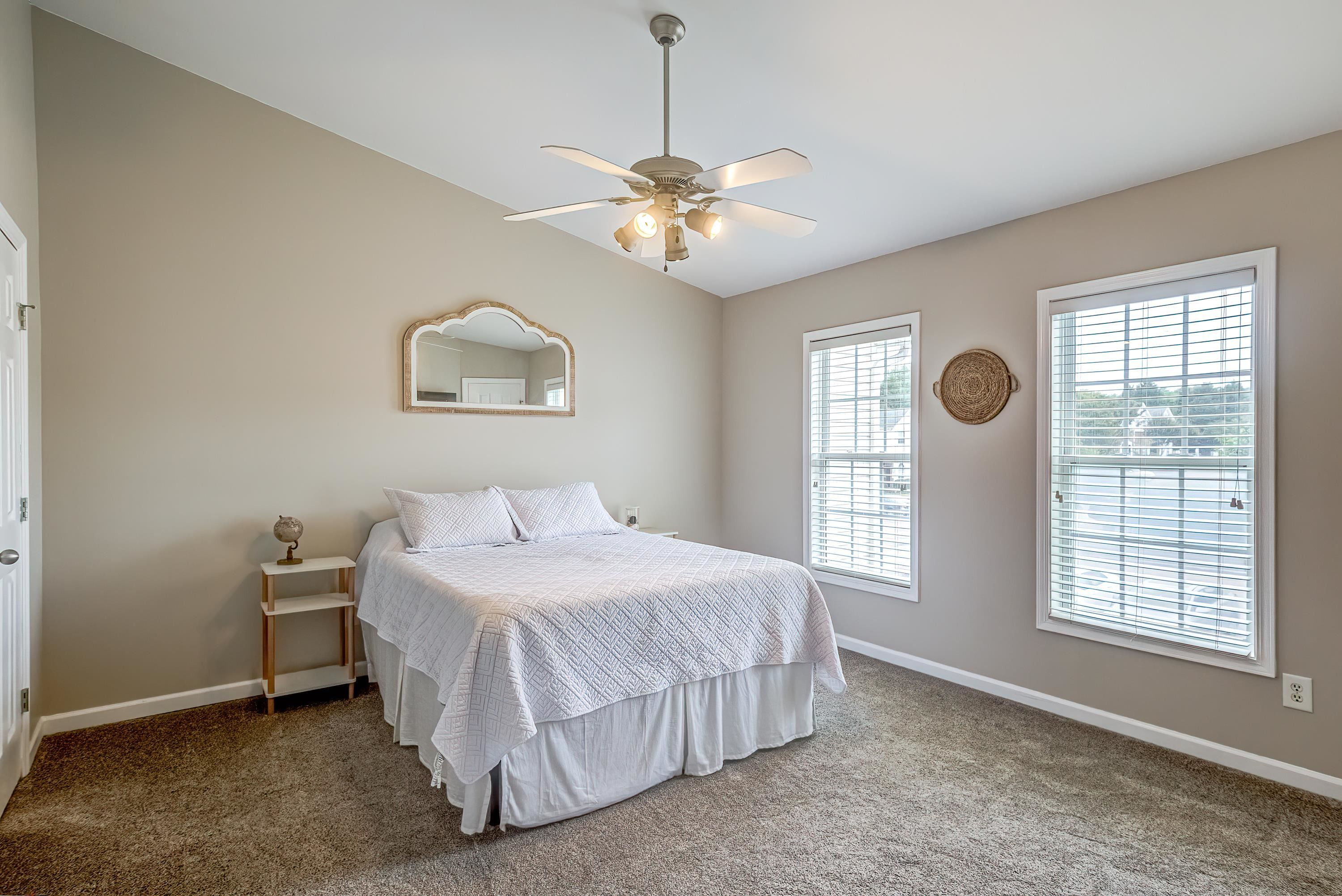 2131 Piney Brook Road, Unit 104 Raleigh, NC 27614 - Photo 21 of 37 a bedroom with a bed and a window
