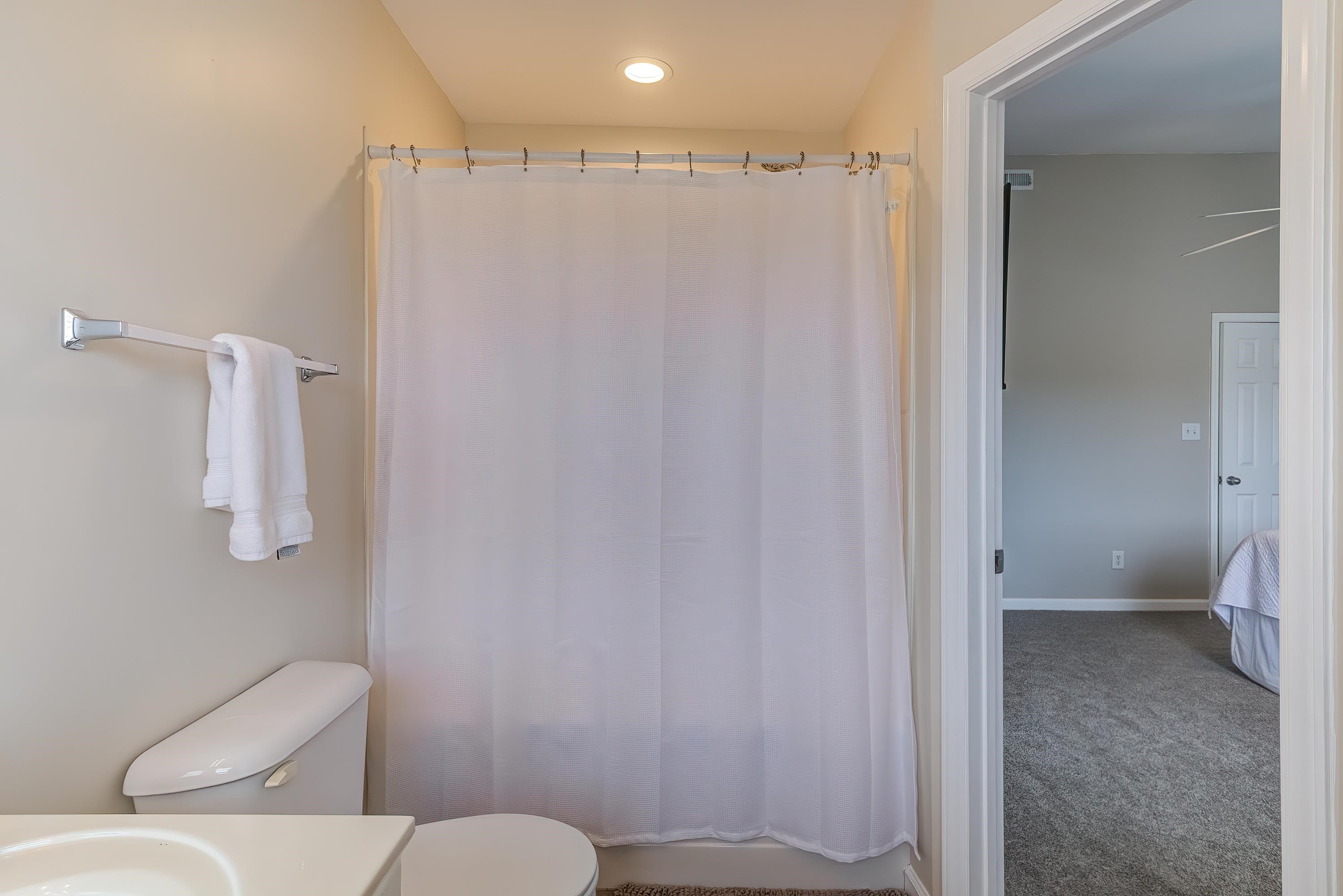 2131 Piney Brook Road, Unit 104 Raleigh, NC 27614 - Photo 26 of 37 a bathroom with a toilet and a shower
