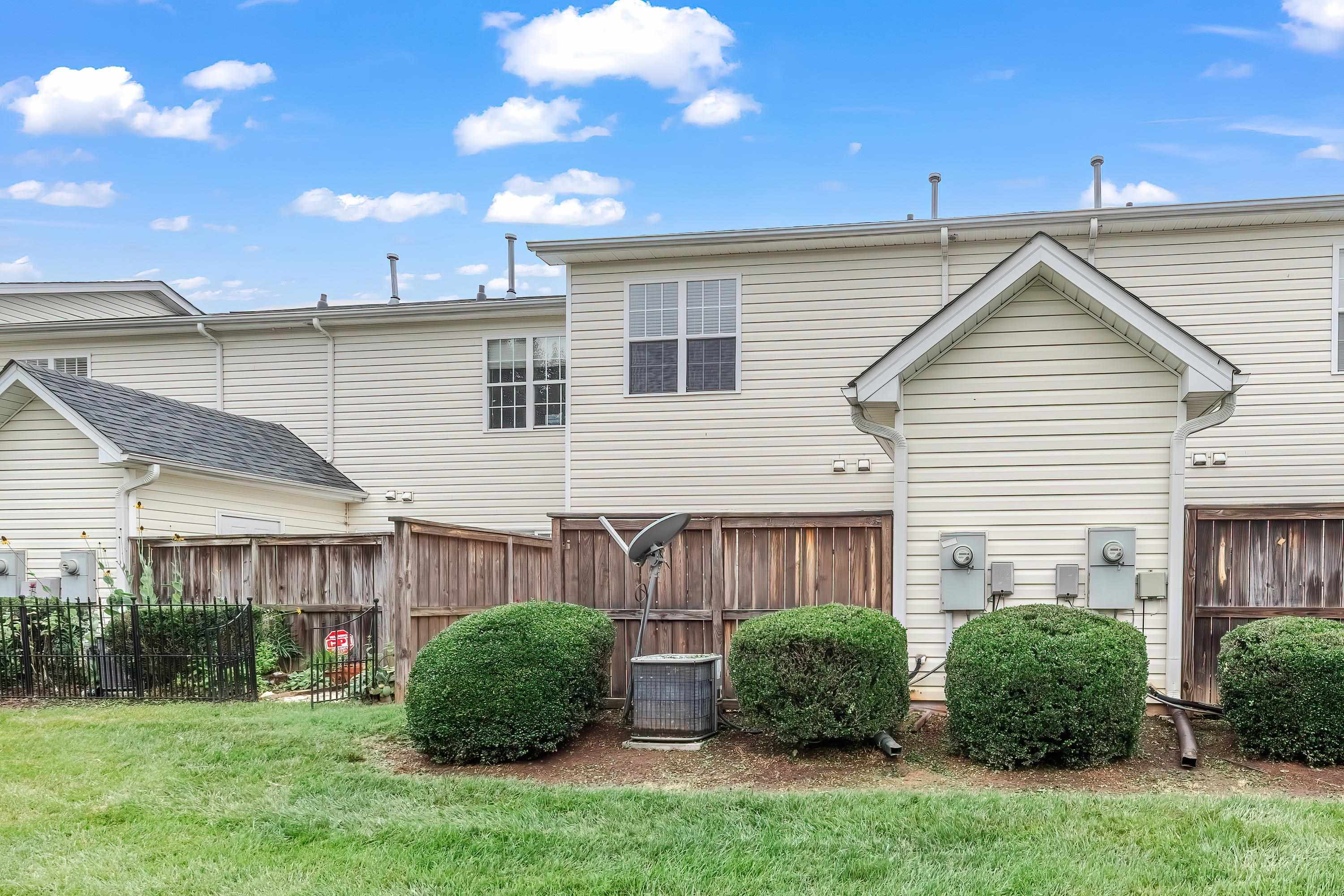 2131 Piney Brook Road, Unit 104 Raleigh, NC 27614 - Photo 35 of 37 a view of a house with a backyard