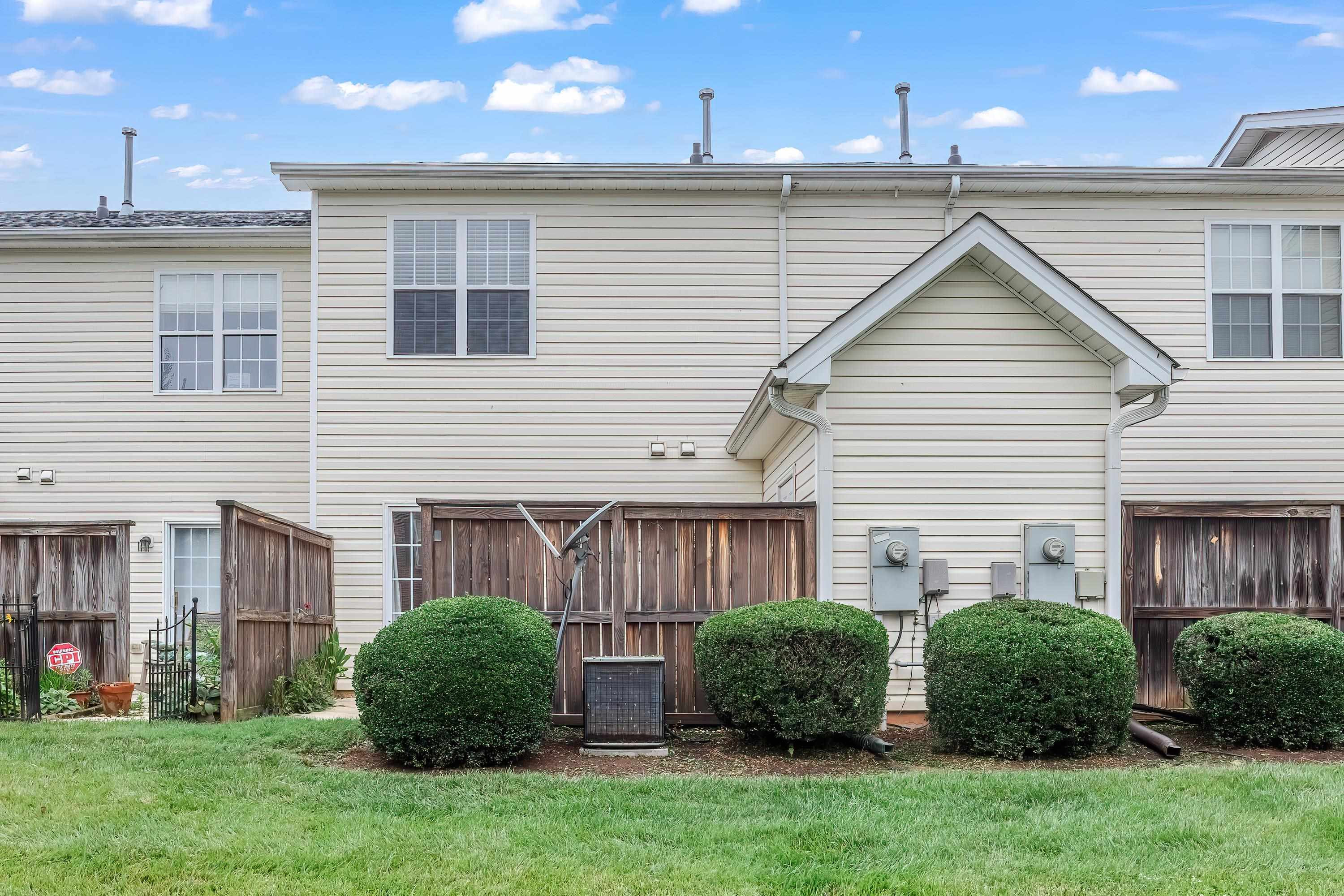 2131 Piney Brook Road, Unit 104 Raleigh, NC 27614 - Photo 36 of 37 a view of a house with a yard and plants