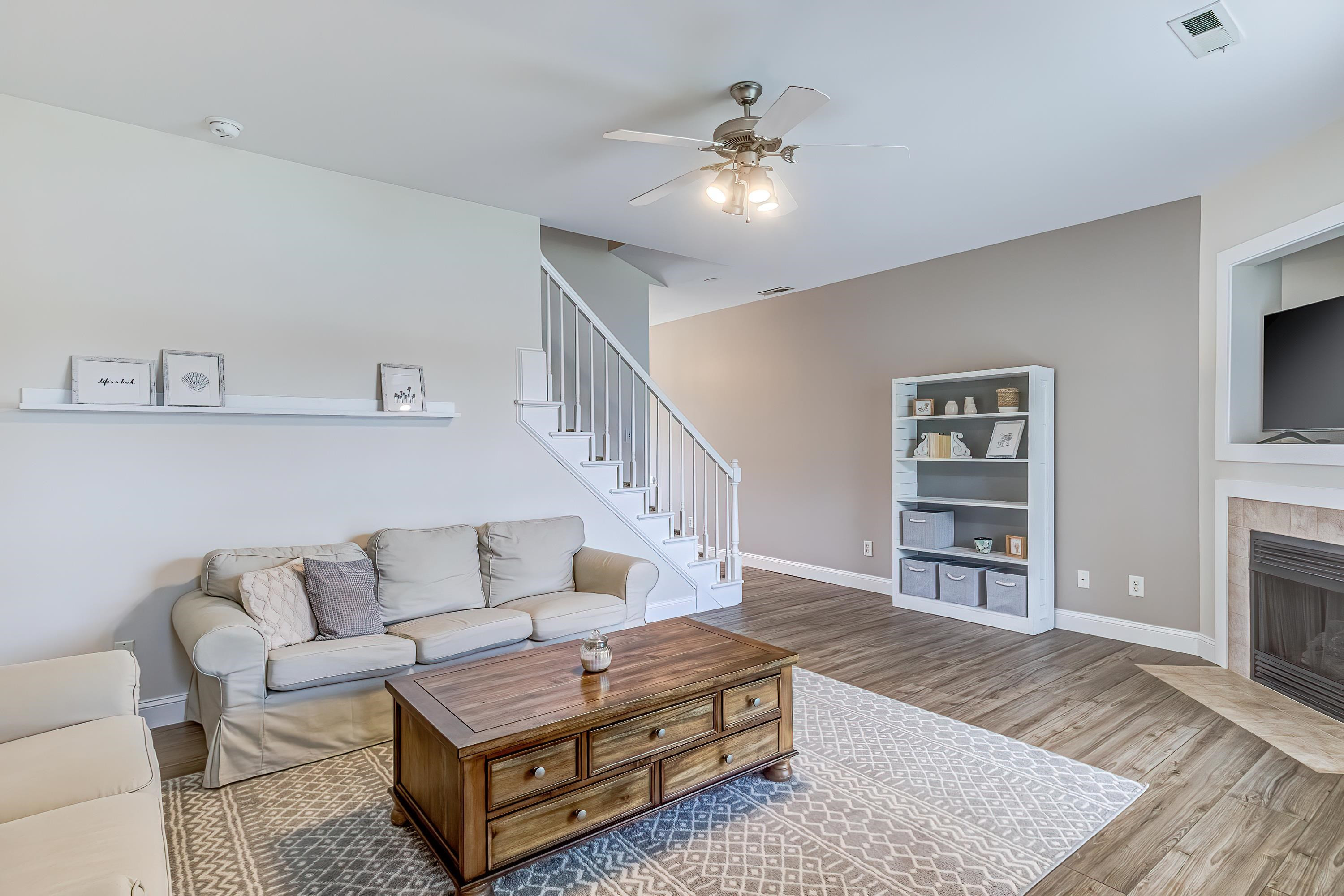 2131 Piney Brook Road, Unit 104 Raleigh, NC 27614 - Photo 6 of 37 a living room with furniture and a fireplace