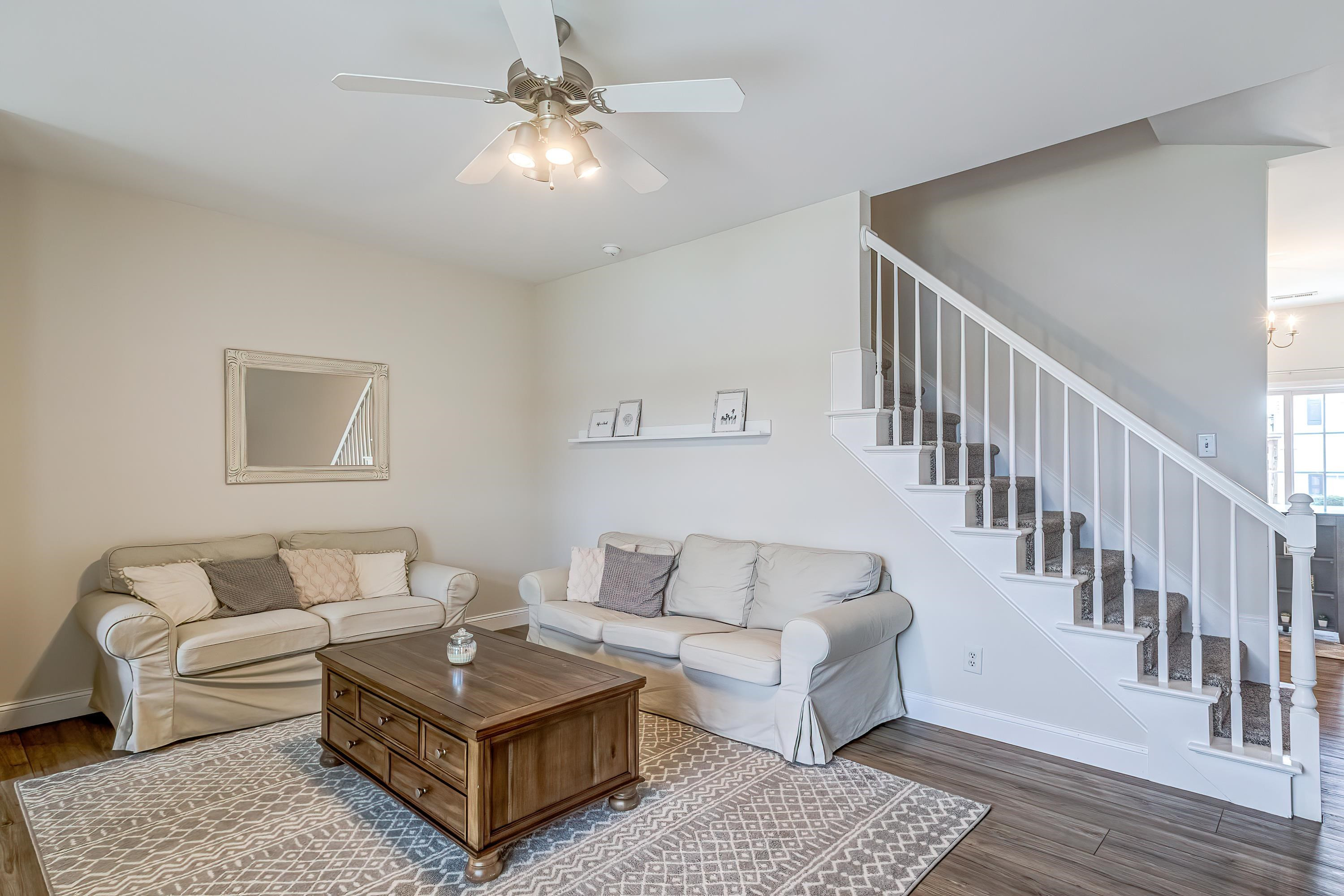2131 Piney Brook Road, Unit 104 Raleigh, NC 27614 - Photo 7 of 37 a living room with furniture and a rug