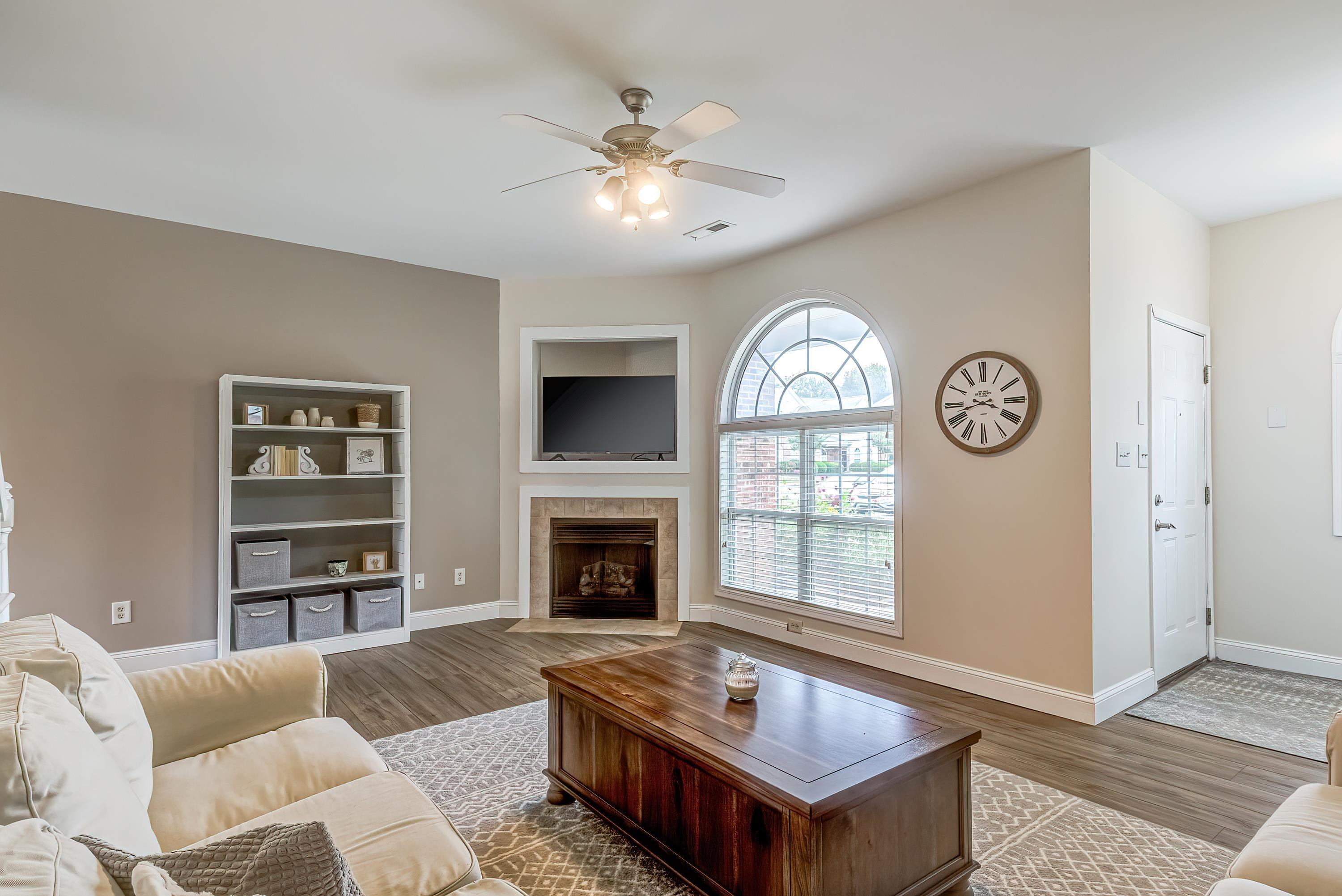 2131 Piney Brook Road, Unit 104 Raleigh, NC 27614 - Photo 9 of 37 a living room with furniture and a fireplace