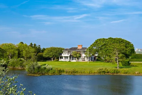 a view of a garden with a building in the background