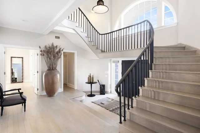 a bedroom with furniture and a window