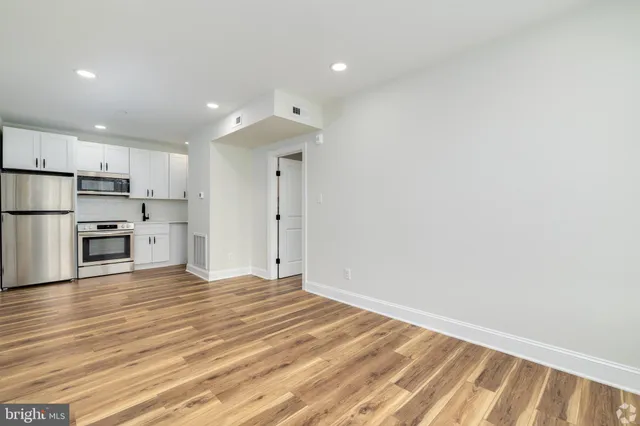 a view of kitchen with wooden floor