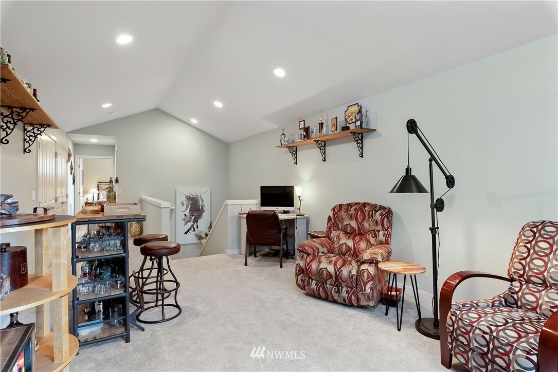 320 Blue Glacier Loop Sequim, WA 98382 - Photo 24 of 38 a living room with furniture and a flat screen tv